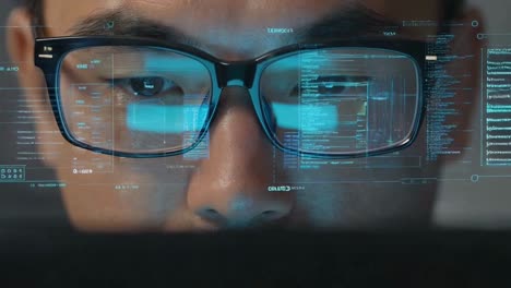 extreme close-up of man's eyes behind glasses with digital interface