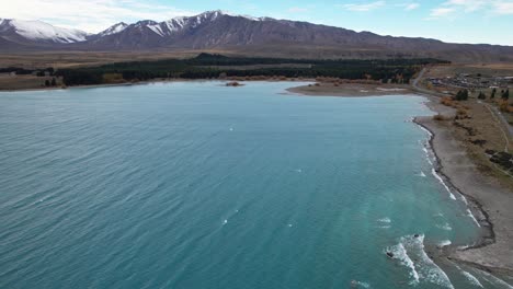 lake tekapo - tekapo township by the lake and mountains in south island, new zealand. - aerial shot
