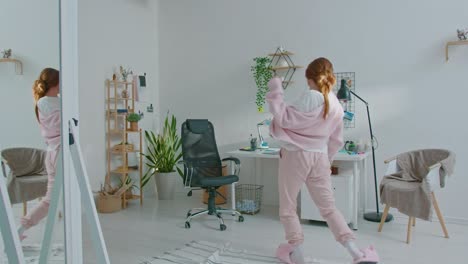 happy woman designer dancing while listening to music
