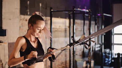 Slow-Motion-Of-Confident-Sporty-Woman-Exercising-On-Machine-At-Gym