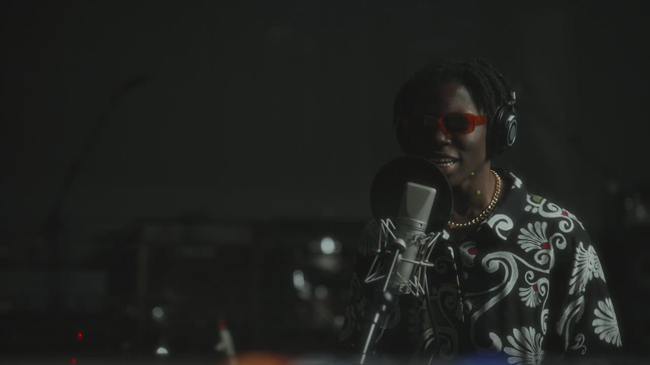 African American Musician Expressively Performing in Recording Booth