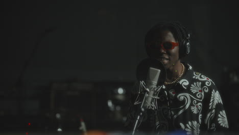 african american musician expressively performing in recording booth