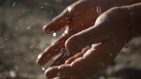 close-up of hands washing in water