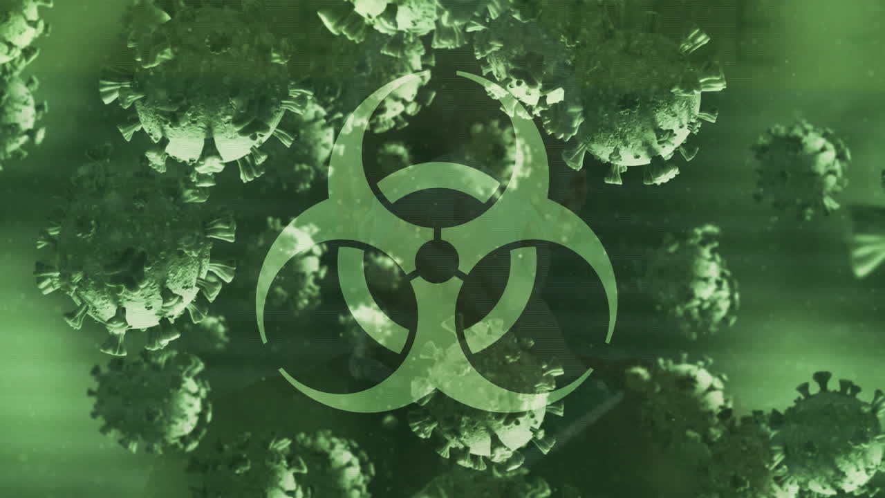 animación de las células del virus covid 19 y el icono de riesgo biológico sobre fondo verde