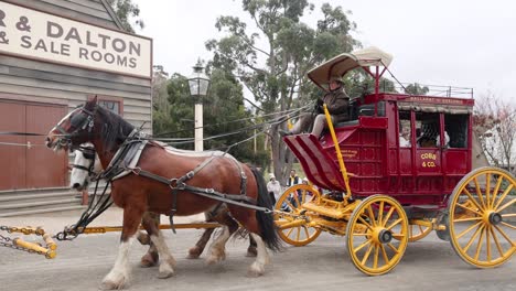 horse-drawn carriage passing by historic buildings