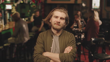 portrait of bearded man at bar