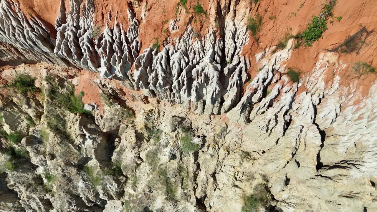 Cinematic drone footage of the stunning red clay cliffs at Miradouro da Lua (Viewpoint of the Moon) in Belas Municipality, Luanda Province, Angola, Africa