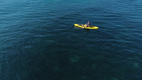 aerial view of kayak fishing at seascape, trolling fishing drone view