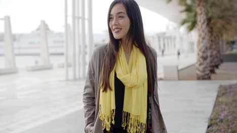 stylish young woman enjoying a walk in town