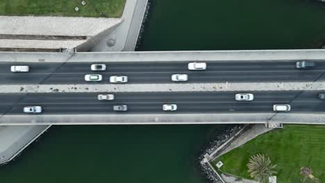 Traffic-at-bridge-aerial-view,-busy-urban-traffic,-Urban-aerials,-City-traffic,-4K-Footage