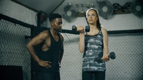 woman lifting weights in gym