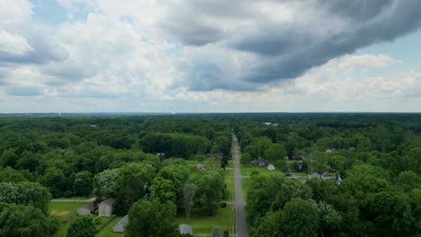 High-quality-aerial-footage-capturing-a-green-neighborhood-under-a-cloudy-sky