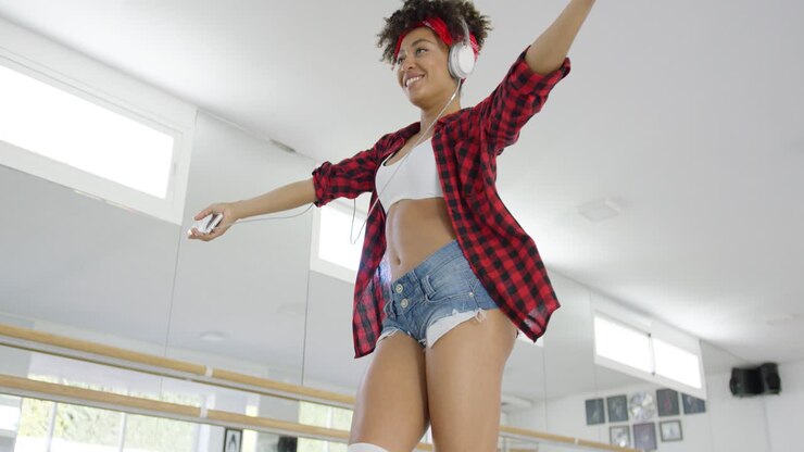 Low angle view of attractive dancer in shorts