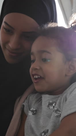 mother and daughter at home