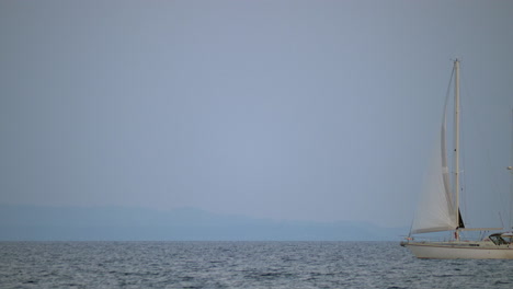 White-yacht-sailing-in-quiet-sea