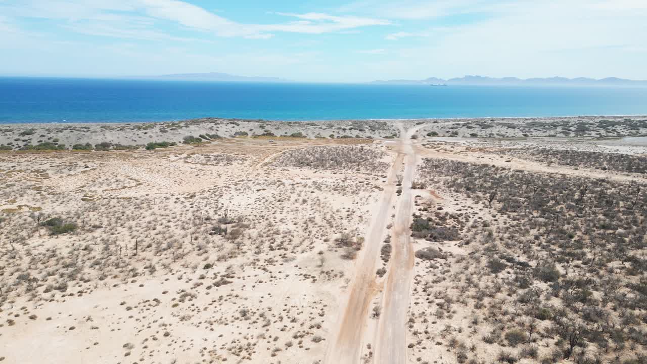 Lonely desert road to ocean, aerial view near La Paz, Baja California Sur, Mexico