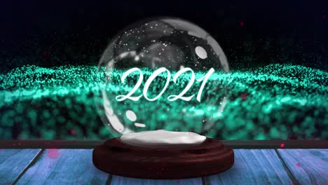 Animation-of-falling-glitter,-snow-globe-and-2021-on-black-background