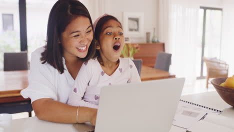 Parent,-laptop-and-high-five-with-child-at-desk