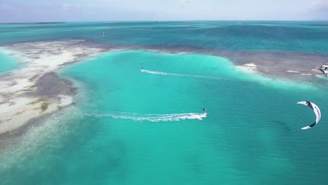 young men flying and jump while cross palafito los roques venezuela