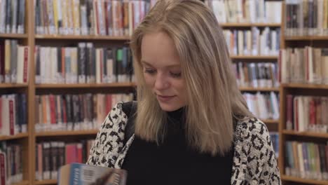 close up of pretty girl in a library, she found a book she was looking for