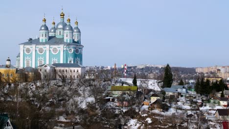 winter cityscape with a church in the foreground