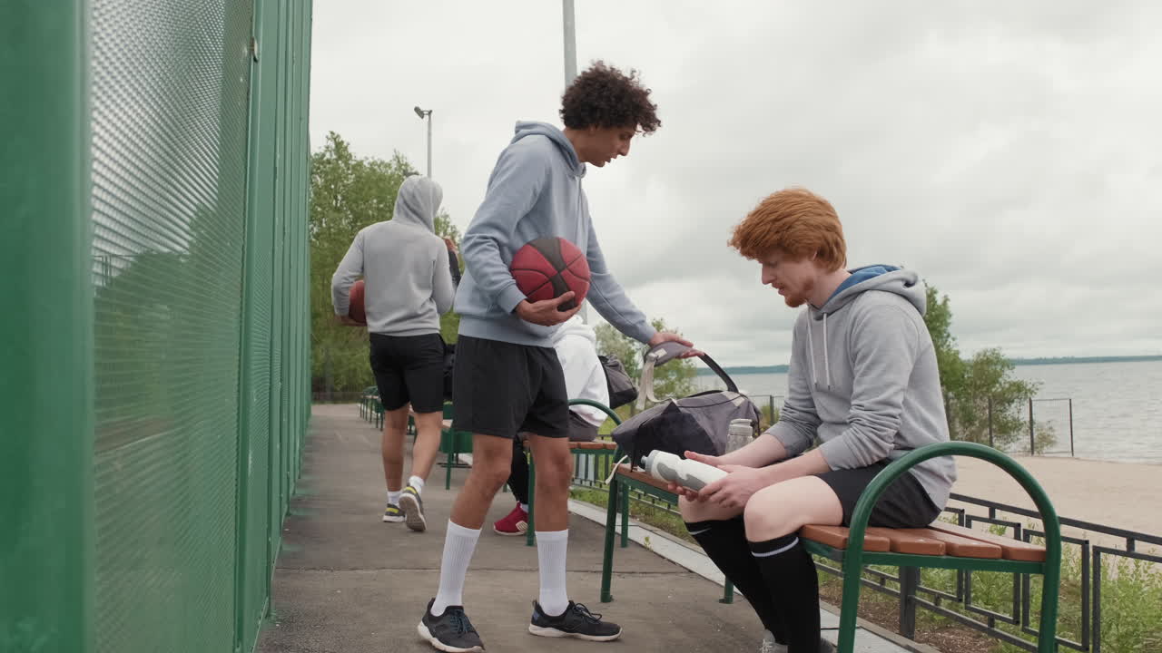 Group of Athletes Relaxing After a Basketball Game