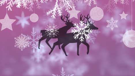 Christmas-hanging-decorations-over-two-reindeers-walking-against-snowflakes-on-purple-background
