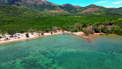 aerial descend over sea in cabo beach in coron philippines