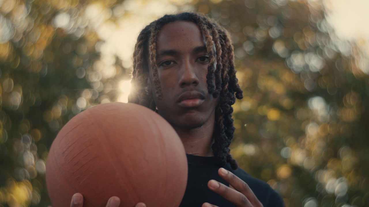 Young Man Holding a Basketball