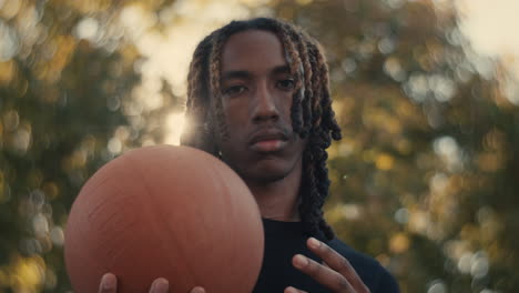 young man holding a basketball