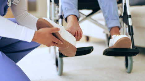 shoes, wheelchair and caregiver help patient