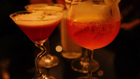 colorful cocktails on a dimly lit table