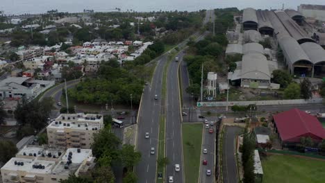 Nunez-de-Caceres-road-leading-to-sea-in-Dominican-Republic-national-district,-Dominican-Republic