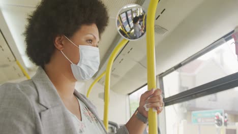 plus size biracial woman wearing face mask in bus