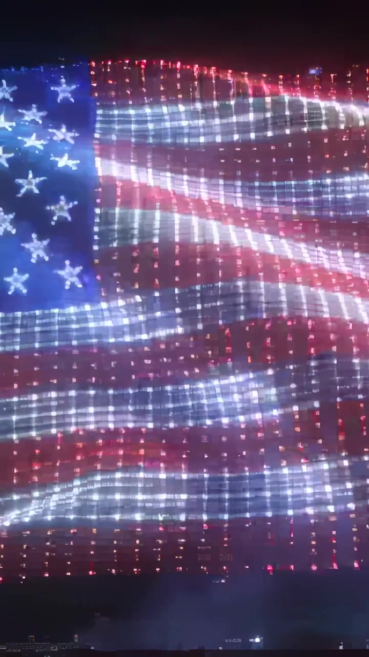 Vertical video: Signal starting, American-flag drone formation pulsing and rippling for night show
