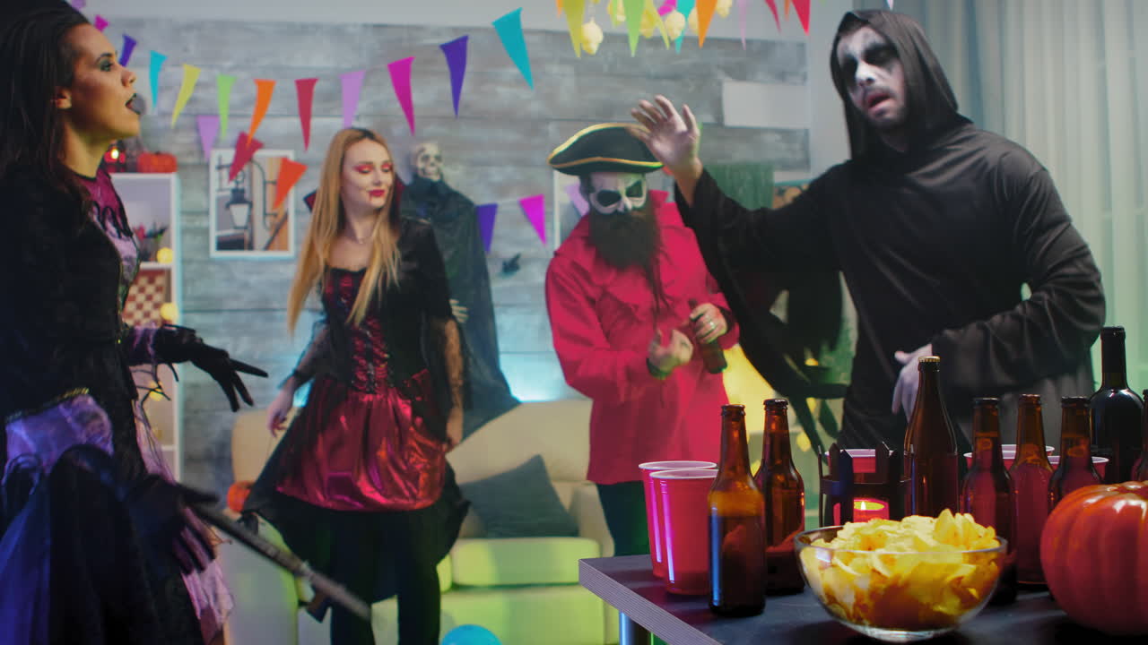 Scary grim reaper taking a beer celebrating halloween