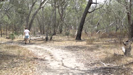 Still-shot-man-jogging-through-scene-in-the-bush