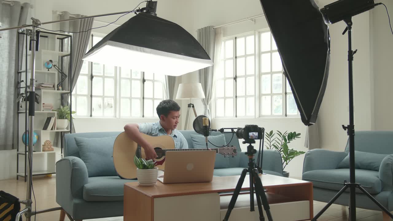 Teenage Musician Recording a Song at Home
