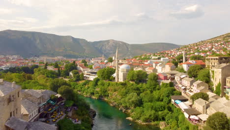 Flight-Over-Old-Bridge-To-Koski-Mehmed-Pasha-Mosque-At-The-City-Of-Mostar-In-Bosnia-and-Herzegovina