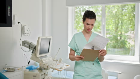 nurse reviewing medical records in a clinic