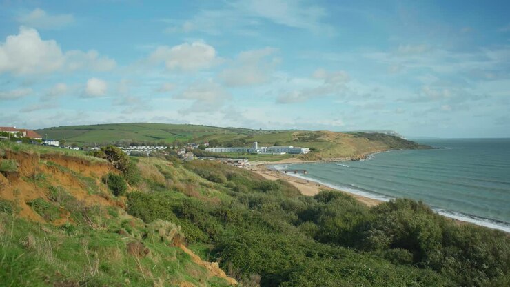 4K Landscape panoramic view shot of Weymouth's beach sea front, on a sunny day