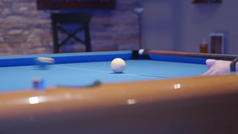 Snooker-balls--a-man-aiming-in-a-snook-table