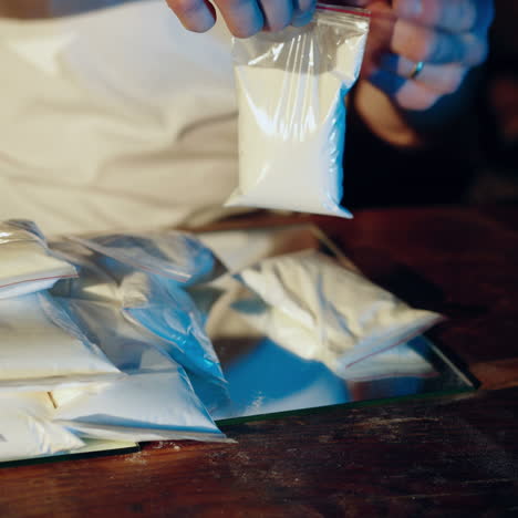 drug addict or drug dealer with packages of heroin or cocaine. criminal business square video