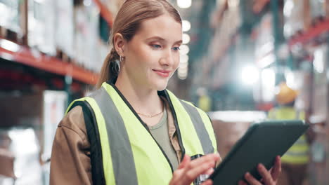 warehouse worker using tablet for inventory management