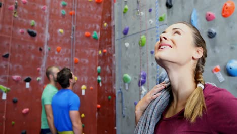 confident woman standing with rope in fitness studio 4k