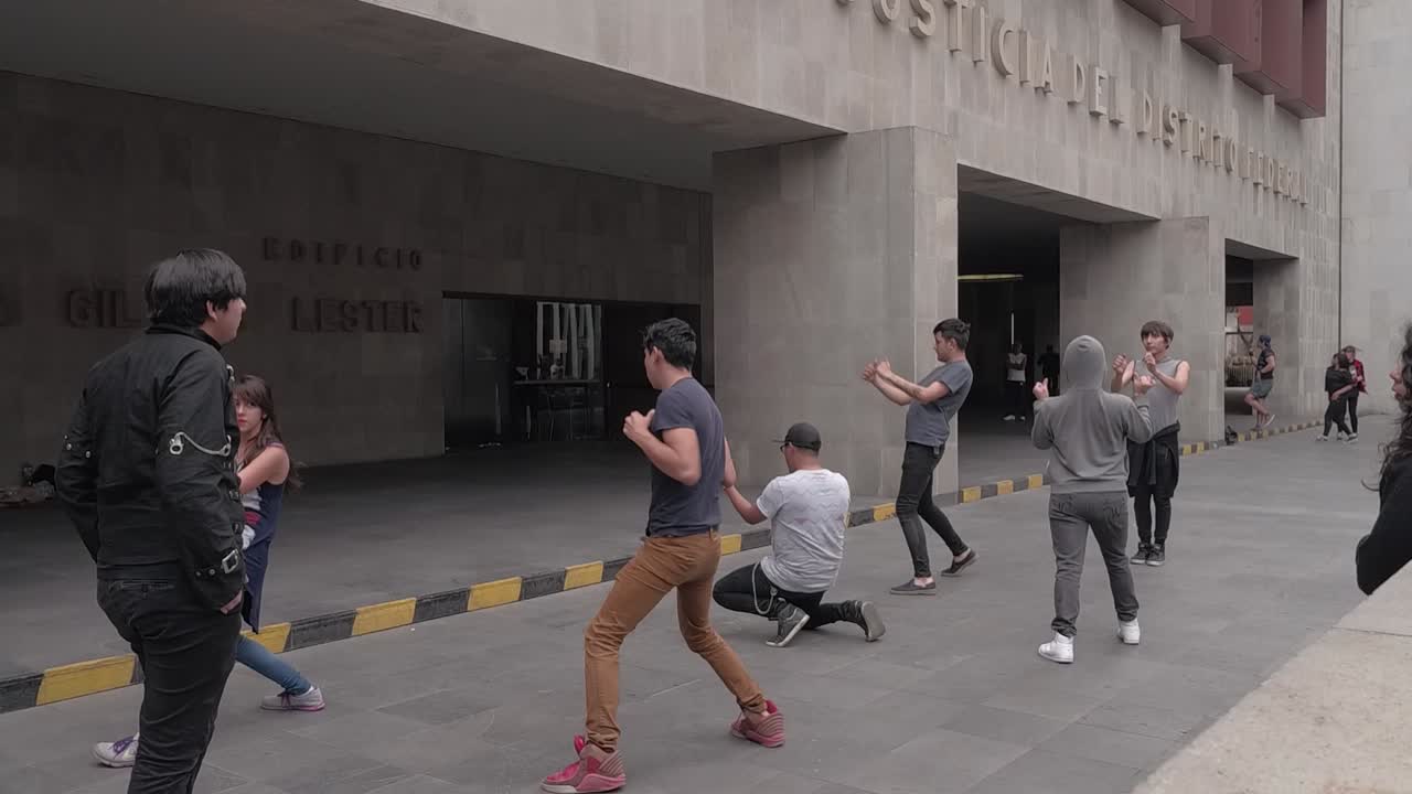 Young urban dancers practicing Tik-Tok choreography in street. Slow motion