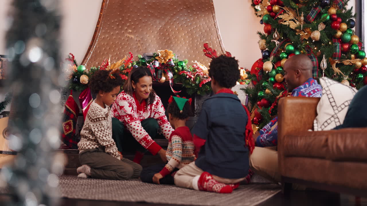 Family celebrating Christmas with presents and a decorated tree