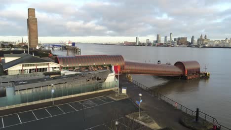 woodside ferry village terminal aerial descending view birkenhead liverpool harbour skyline in background