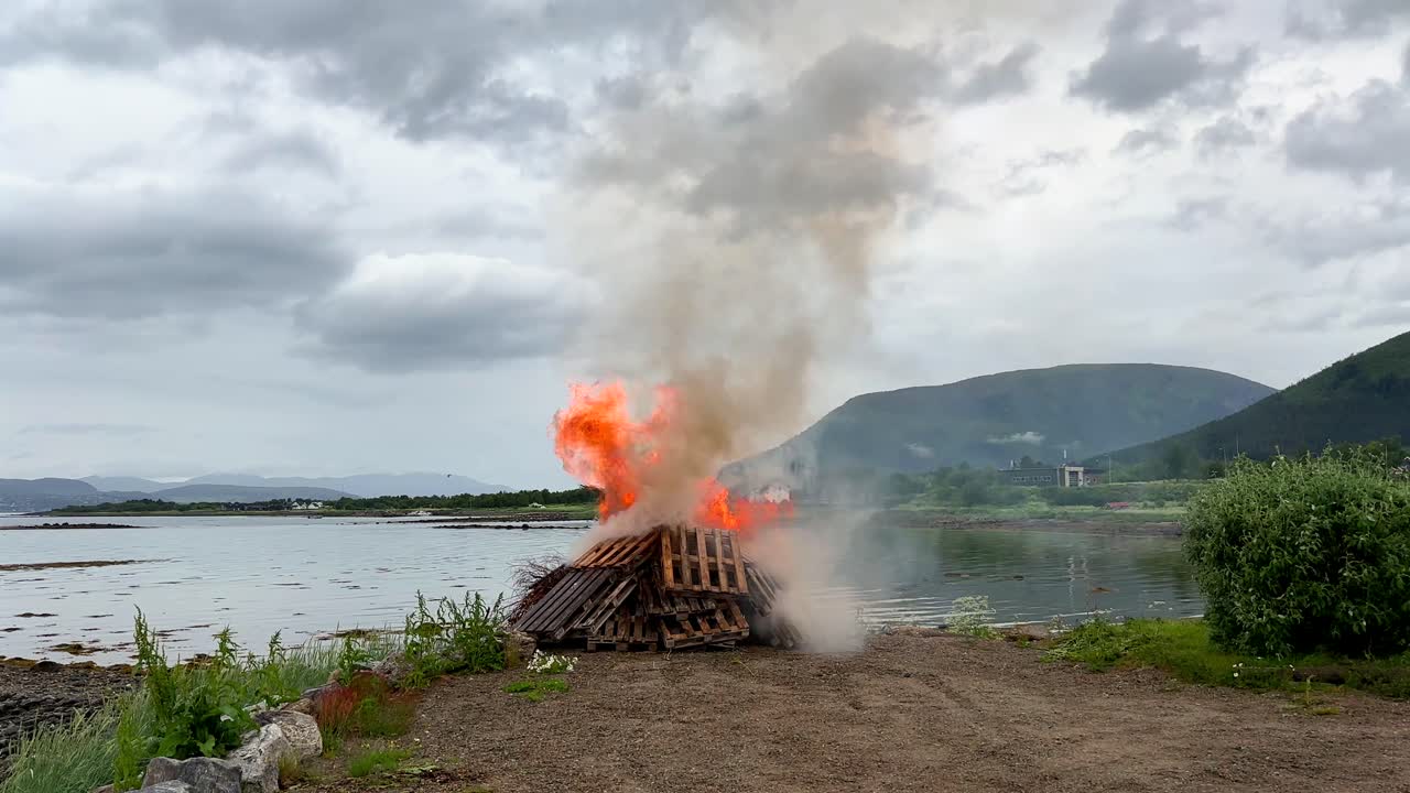 Old Scandinavian holiday tradition burning old pallets and wood to celebrate midsummer, summer solstice