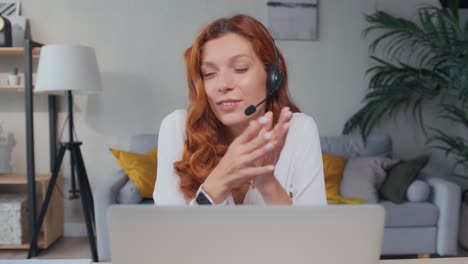 young caucasian woman talking enthusiastically using headset and smiling